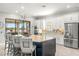 Bright, spacious kitchen features a large island, stainless steel appliances, and a seamless flow to the outdoor living space at 5011 Tivoli Run, Bradenton, FL 34211