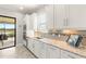 Well-equipped kitchen with stainless appliances, stylish countertops, and an adjacent eating area for seamless entertaining at 5011 Tivoli Run, Bradenton, FL 34211