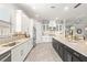 Well-appointed kitchen featuring custom cabinetry, a central island, and stainless appliances for culinary enthusiasts at 5011 Tivoli Run, Bradenton, FL 34211