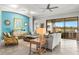 Stylish living room with modern decor, comfortable seating, and sliding doors to an outdoor space at 5011 Tivoli Run, Bradenton, FL 34211