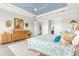 Comfortable main bedroom with white trim, wood dresser, and light gray walls at 5011 Tivoli Run, Bradenton, FL 34211