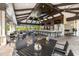 Outdoor restaurant with tables and chairs and a full bar with televisions in the background at 5011 Tivoli Run, Bradenton, FL 34211