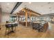 Bright restaurant interior featuring a full bar, wooden tables and chairs, and light wood flooring at 5011 Tivoli Run, Bradenton, FL 34211