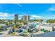 Rooftop view of the neighborhood, the beach and ocean beyond the buildings at 5219 Calle Menorca, Sarasota, FL 34242