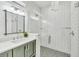 Modern bathroom features a glass shower, patterned tile floor, and sleek vanity with undermount sink at 5219 Calle Menorca, Sarasota, FL 34242