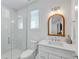 Modern bathroom with walk-in shower, white vanity, and stylish fixtures at 5219 Calle Menorca, Sarasota, FL 34242