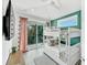 ' bedroom with bunk beds, outdoor access, and modern finishes at 5219 Calle Menorca, Sarasota, FL 34242