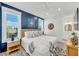 Charming bedroom features wainscoting, two windows, and coastal decor at 5219 Calle Menorca, Sarasota, FL 34242
