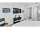 Bright bedroom features a TV, chair, and modern decor at 5219 Calle Menorca, Sarasota, FL 34242