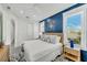Bright bedroom with large windows, stylish lighting, and modern decor at 5219 Calle Menorca, Sarasota, FL 34242