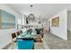 View of formal dining room looking into a modern kitchen with large island at 5219 Calle Menorca, Sarasota, FL 34242
