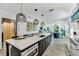 Contemporary eat-in kitchen features a large center island and open floor plan at 5219 Calle Menorca, Sarasota, FL 34242