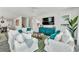 Bright and airy living room featuring stylish coastal decor and plenty of seating at 5219 Calle Menorca, Sarasota, FL 34242