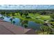 Beautifully landscaped golf course with a serene pond and walking bridge at 5330 Hyland Hills Ave # 2324, Sarasota, FL 34241