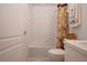 Well-maintained bathroom featuring a shower-tub combination and white tiled walls at 5330 Hyland Hills Ave # 2324, Sarasota, FL 34241
