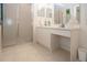 Neat bathroom with glass-enclosed shower, spacious vanity, and ample lighting at 5330 Hyland Hills Ave # 2324, Sarasota, FL 34241
