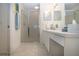 Clean bathroom featuring a glass-enclosed shower, vanity with ample storage, and neutral tones at 5330 Hyland Hills Ave # 2324, Sarasota, FL 34241