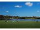 Scenic driving range over a tranquil lake, perfect for practicing your swing surrounded by nature at 5330 Hyland Hills Ave # 2324, Sarasota, FL 34241
