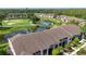 A picturesque community with lush landscaping, a pond, a golf course and multi-Gathering residential buildings at 5330 Hyland Hills Ave # 2324, Sarasota, FL 34241