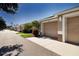 Exterior view of townhome garages in a manicured community at 5330 Hyland Hills Ave # 2324, Sarasota, FL 34241