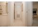 Bright hallway with tile flooring leading to bathroom and living area at 5330 Hyland Hills Ave # 2324, Sarasota, FL 34241