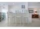 Bright breakfast bar with seating area flowing into a cozy dining area, perfect for casual meals and gatherings at 5330 Hyland Hills Ave # 2324, Sarasota, FL 34241