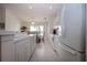 Bright kitchen leading to dining area, featuring modern appliances and ample countertop space at 5330 Hyland Hills Ave # 2324, Sarasota, FL 34241