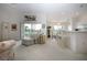 Bright living room with vaulted ceilings, neutral furniture, and a view of the outdoor deck at 5330 Hyland Hills Ave # 2324, Sarasota, FL 34241