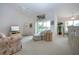 Open-concept living room with bar, access to balcony, and plenty of natural light at 5330 Hyland Hills Ave # 2324, Sarasota, FL 34241