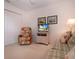 Bright room with plaid sofa, floral chair, and entertainment center at 5330 Hyland Hills Ave # 2324, Sarasota, FL 34241