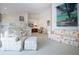 Inviting living room featuring a bar with seating and open concept to a kitchen area at 5330 Hyland Hills Ave # 2324, Sarasota, FL 34241