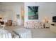 Inviting living room featuring comfortable seating, nautical wall decor, and coastal design elements at 5330 Hyland Hills Ave # 2324, Sarasota, FL 34241
