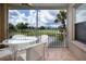 Relaxing screened patio with golf course views, featuring a dining table and comfortable seating at 5330 Hyland Hills Ave # 2324, Sarasota, FL 34241