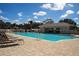Stunning pool with clear blue water, plenty of seating, and a shaded bar area at 5330 Hyland Hills Ave # 2324, Sarasota, FL 34241
