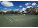 Well-maintained tennis court with green surface and new net, perfect for a game of tennis with friends at 5330 Hyland Hills Ave # 2324, Sarasota, FL 34241
