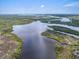 Stunning aerial view showcasing the expansive waterways and lush landscape surrounding the property at 550 Tampico Dr, North Port, FL 34287