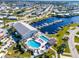 Aerial view of community clubhouse, pool, spa, boat docks and marina amenities at 550 Tampico Dr, North Port, FL 34287