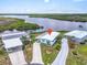 Aerial view of home showing the property, water access, and surrounding homes at 550 Tampico Dr, North Port, FL 34287