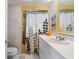 Bathroom with a shower and a white vanity at 550 Tampico Dr, North Port, FL 34287
