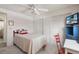 Bright bedroom with a bed, storage, and a tv at 550 Tampico Dr, North Port, FL 34287