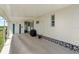 Covered carport area providing ample space, with views of the surrounding yard and access to the home at 550 Tampico Dr, North Port, FL 34287