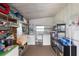 Functional laundry room with washer, dryer, shelving, and storage solutions at 550 Tampico Dr, North Port, FL 34287