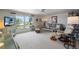 Cozy living room with plush seating, ample natural light, and scenic views from the window at 550 Tampico Dr, North Port, FL 34287