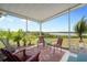 Enjoy outdoor living on this screened patio with water views at 550 Tampico Dr, North Port, FL 34287