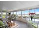 Bright and airy sunroom offering scenic water views, with comfortable seating and stylish decor at 550 Tampico Dr, North Port, FL 34287