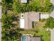 This aerial view showcases a well-maintained home with a new, bright white flat roof addition at 5639 Blount Ave, Sarasota, FL 34231