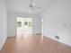 Light bedroom shows hardwood floors, white walls, and french doors to an office at 5639 Blount Ave, Sarasota, FL 34231