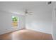 A light-filled bedroom features wood-look floors and a bright window at 5639 Blount Ave, Sarasota, FL 34231