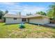 Quaint single-story home features a well-maintained lawn, front yard fountain and attached two-car garage at 5639 Blount Ave, Sarasota, FL 34231