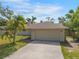 Charming home featuring a two-car garage, well-manicured lawn and mature trees at 5639 Blount Ave, Sarasota, FL 34231